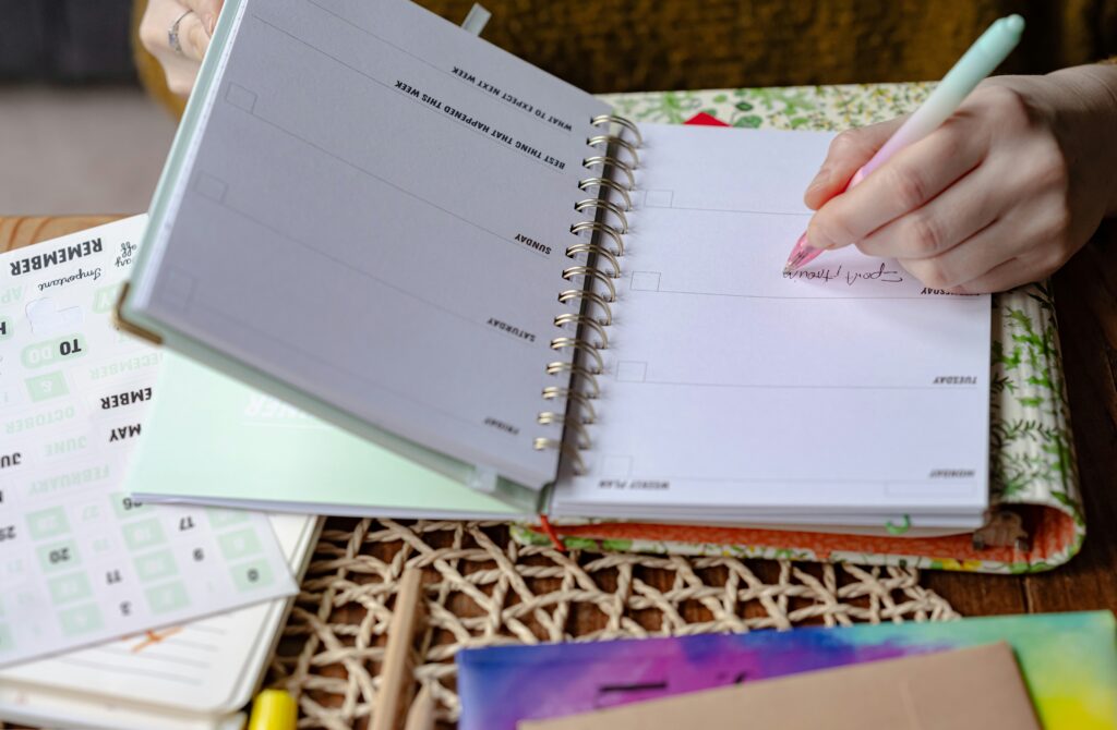 woman tracking period symptoms in journal